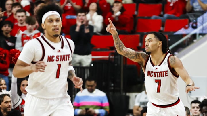 Jan 17, 2026; Raleigh, North Carolina, USA;  NC State Wolfpack guard Alyn Breed (7) celebrates a 3-pointer during the first half of the game against the Georgia Tech Yellow Jackets at Lenovo Center. Mandatory Credit: Jaylynn Nash-Imagn Images