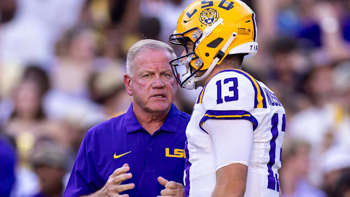  LSU Tigers quarterback Garrett Nussmeier talks to head coach Brian Kelly during warmups before a game against the South Alabama Jaguars at Tiger Stadium. 