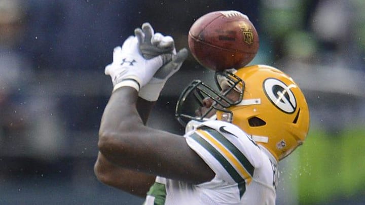 Green Bay Packers' Brandon Bostick (86) misses the ball while trying to recover an onside kick against the Seattle Seahawks.