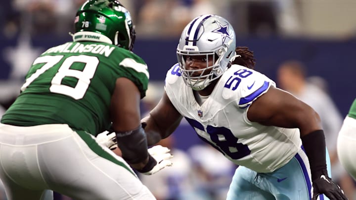 Sep 17, 2023; Arlington, Texas, USA; Dallas Cowboys defensive tackle Mazi Smith (58) rushes the passer while blocked by New York Jets guard Laken Tomlinson (78) in the third quarter at AT&T Stadium. Mandatory Credit: Tim Heitman-USA TODAY Sports