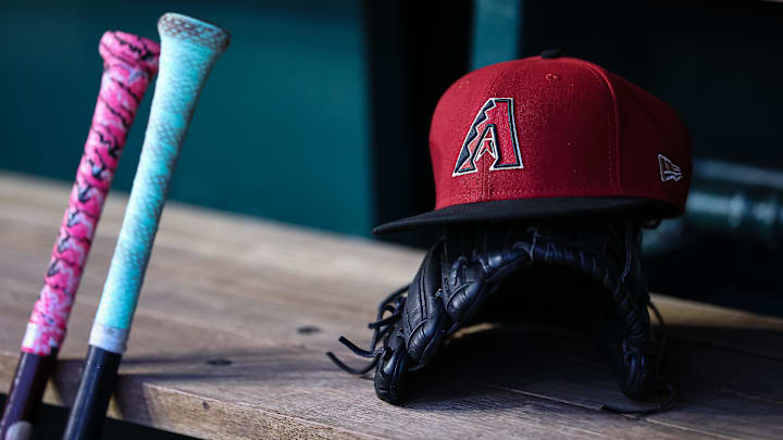 Jun 7, 2023; Washington, District of Columbia, USA; A general view of an Arizona Diamondbacks hat, glove, and bats in the dugout during the fifth inning of the game against the Washington Nationals at Nationals Park. 