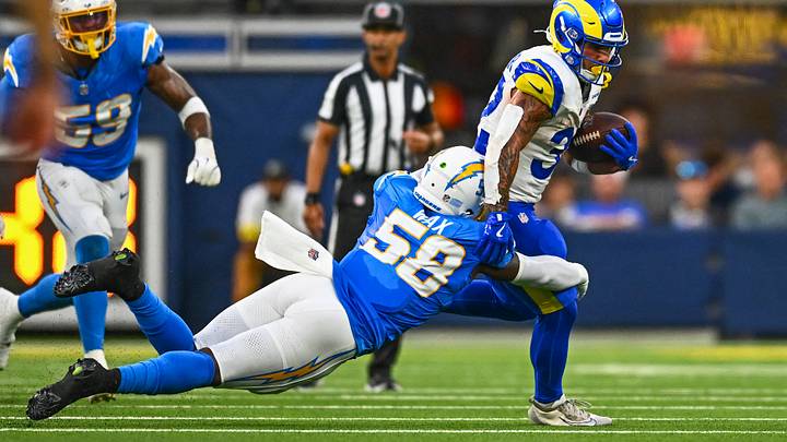 Aug 16, 2025; Inglewood, California, USA; Chargers linebacker Marlowe Wax (58) tackles Rams running back Cody Schrader (32) during the fourth quarter at SoFi Stadium. Mandatory Credit: Jonathan Hui-Imagn Images