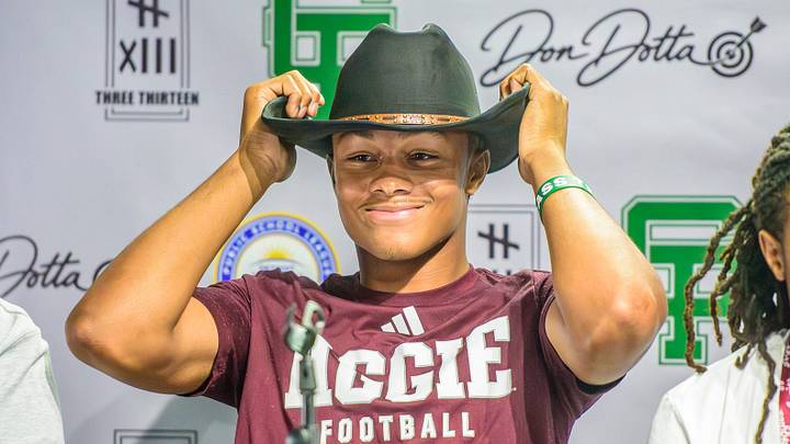 Detroit Cass Tech’s Donald Tabron II swaps his Texas A&M cap for a cowboy hat after the five-star junior quarterback committed to the Aggies on Saturday, Aug. 15, 2026, at Three Thirteen Store in Detroit. Detroit Cass Tech’s Donald Tabron II swaps his Texas A&M cap for a cowboy hat after the five-star junior quarterback committed to the Aggies on Saturday, Aug. 15, 2026, at Three Thirteen Store in Detroit.