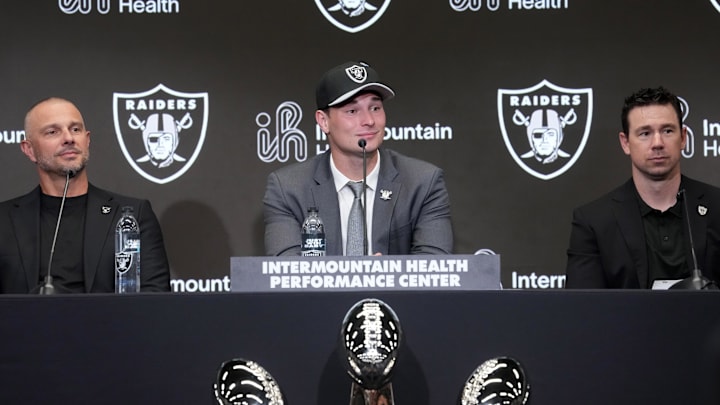 Apr 24, 2026; Henderson, NV, USA; Las Vegas Raiders quarterback Fernando Mendoza (center) speaks at introductory press conference at Intermountain Health Performance Center flanked by general manager John Spytek (left) and head coach Klint Kubiak after being selected as the No. 1 pick in the 2026 NFL Draft. Mandatory Credit: Kirby Lee-Imagn Images Apr 24, 2026; Henderson, NV, USA; Las Vegas Raiders quarterback Fernando Mendoza (center) speaks at introductory press conference at Intermountain Health Performance Center flanked by general manager John Spytek (left) and head coach Klint Kubiak after being selected as the No. 1 pick in the 2026 NFL Draft. Mandatory Credit: Kirby Lee-Imagn Images
