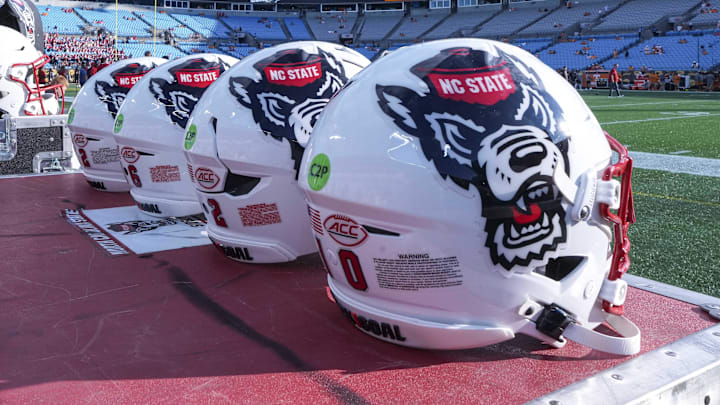Sep 7, 2024; Charlotte, North Carolina, USA; North Carolina State Wolfpack helmets during pregame activity for the Dukes Mayo Classic against the Tennessee Volunteers at Bank of America Stadium. Mandatory Credit: Jim Dedmon-Imagn Images