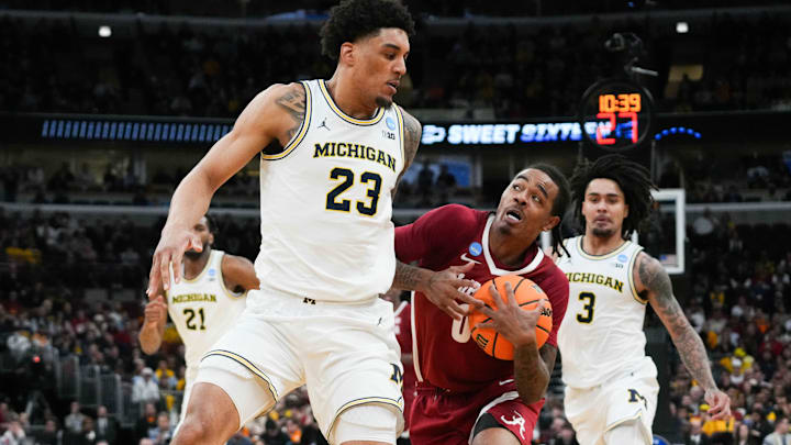Mar 27, 2026; Chicago, IL, USA; Alabama Crimson Tide guard Labaron Philon Jr. (0) drives the ball against Michigan Wolverines forward Yaxel Lendeborg (23) in the second half during a Sweet Sixteen game of the Midwest Regional of the men's 2026 NCAA Tournament at United Center. Mandatory Credit: David Banks-Imagn Images