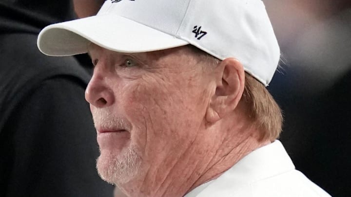 Jan 19, 2026; Miami Gardens, FL, USA; Las Vegas Raiders general manager John Spytek  and owner Mark Davis look on from the sideline before the CFP National Championship college football game between the Indiana Hoosiers and the Miami Hurricanes at Hard Rock Stadium. Mandatory Credit: Kirby Lee-Imagn Images