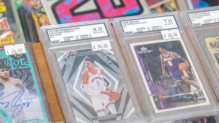 Rare sports cards, some graded for quality, sit in a display shelf at the new shop Stooges Comics & Collectibles in the Oak Cliff Park shopping center in Peoria. Rare sports cards, some graded for quality, sit in a display shelf at the new shop Stooges Comics & Collectibles in the Oak Cliff Park shopping center in Peoria.