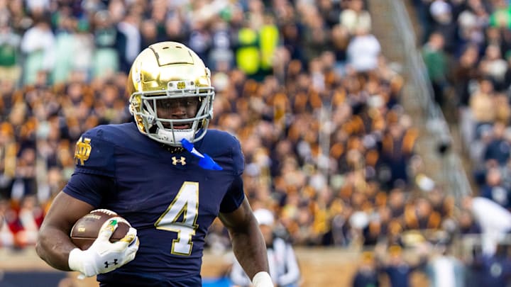 Nov 22, 2025; South Bend, Indiana, USA; Notre Dame Fighting Irish running back Jeremiyah Love (4) breaks loose for a touchdown run against the Syracuse Orange during the first half at Notre Dame Stadium. Mandatory Credit: Michael Caterina-Imagn Images
