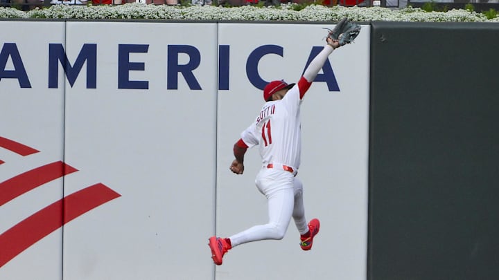Jun 3, 2025; St. Louis, Missouri, USA;  St. Louis Cardinals center fielder Victor Scott II (11) leaps and catches a line drive hit by Kansas City Royals designated hitter Jac Caglianone (not pictured) during the second inning at Busch Stadium. Mandatory Credit: Jeff Curry-Imagn Images