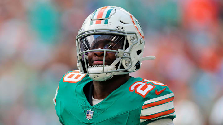 Dec 21, 2025; Miami Gardens, Florida, USA; Miami Dolphins running back De'Von Achane (28) reacts after scoring a touchdown during the first quarter against the Cincinnati Bengals at Hard Rock Stadium. Mandatory Credit: Sam Navarro-Imagn Images