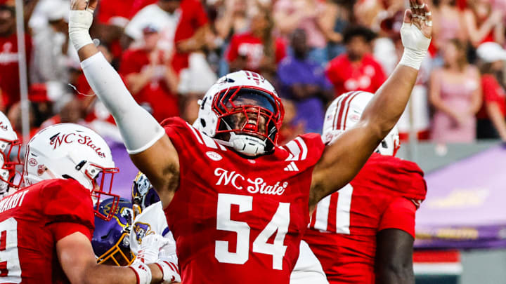 Aug 28, 2025; Raleigh, North Carolina, USA; North Carolina State Wolfpack defensive end Sabastian Harsh (54) celebrates a sack during the first half of the game against East Carolina Pirates at Carter-Finley Stadium. Mandatory Credit: Jaylynn Nash-Imagn Images Aug 28, 2025; Raleigh, North Carolina, USA; North Carolina State Wolfpack defensive end Sabastian Harsh (54) celebrates a sack during the first half of the game against East Carolina Pirates at Carter-Finley Stadium. Mandatory Credit: Jaylynn Nash-Imagn Images