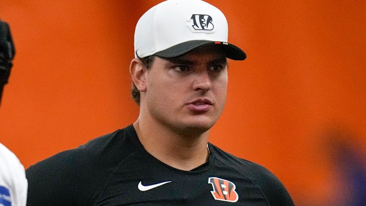 Cincinnati Bengals defensive end Trey Hendrickson (91) assists with drills during a preseason training camp practice in downtown Cincinnati on Thursday, July 31, 2025.
