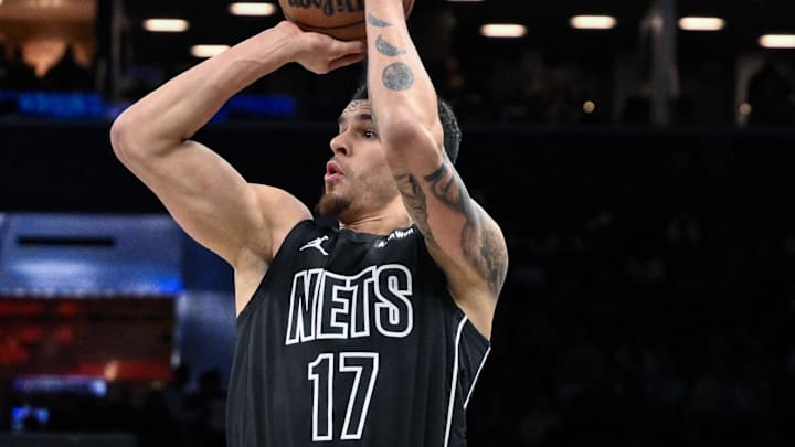 Jan 19, 2026; Brooklyn, New York, USA; Brooklyn Nets forward Michael Porter Jr. (17) shoots the ball against Phoenix Suns guard/forward Dillon Brooks (3) during the first half at Barclays Center. Mandatory Credit: John Jones-Imagn Images
