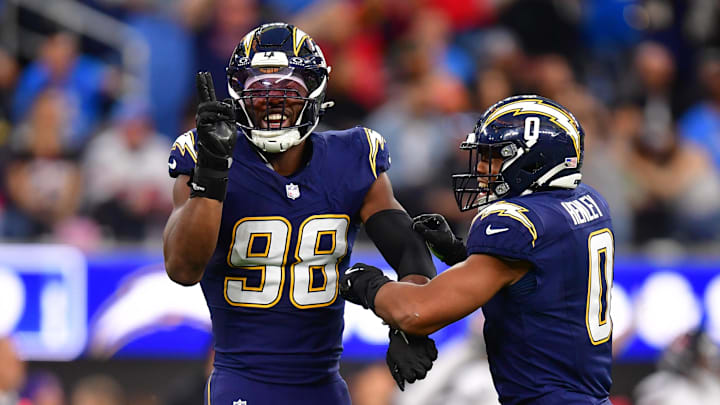 Odafe Oweh and Daiyan Henley celebrate after huge play.