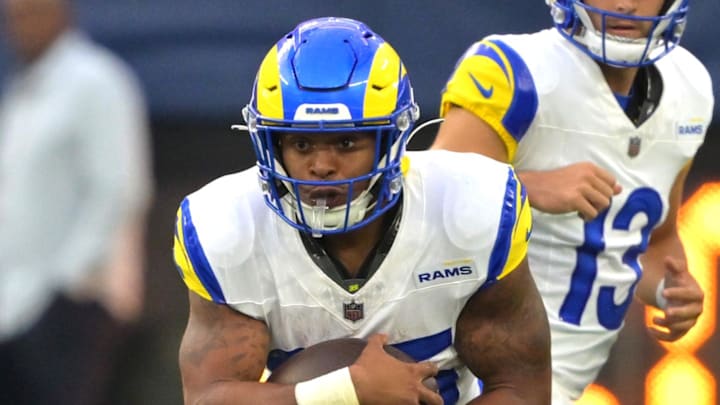 Aug 9, 2025; Inglewood, California, USA;  Los Angeles Rams running back Jarquez Hunter (35) carries the ball past Dallas Cowboys linebacker James Houston (53) during the second half at SoFi Stadium. Mandatory Credit: Jayne Kamin-Oncea-Imagn Images