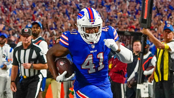 Sep 19, 2022; Orchard Park, New York, USA; Buffalo Bills full back Reggie Gilliam (41) runs with the ball for a touchdown against the Tennesse Titans during the first half at Highmark Stadium. Mandatory Credit: Gregory Fisher-Imagn Images