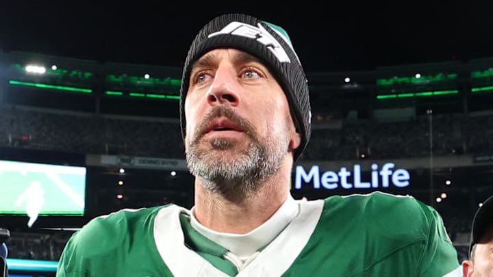 New York Jets quarterback Aaron Rodgers walks off the field following a game.