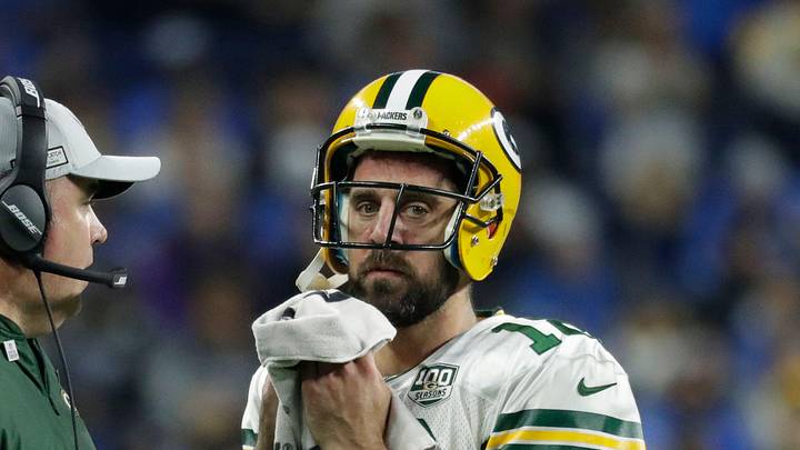 Coach Mike McCarthy talks with Green Bay Packers quarterback Aaron Rodgers
