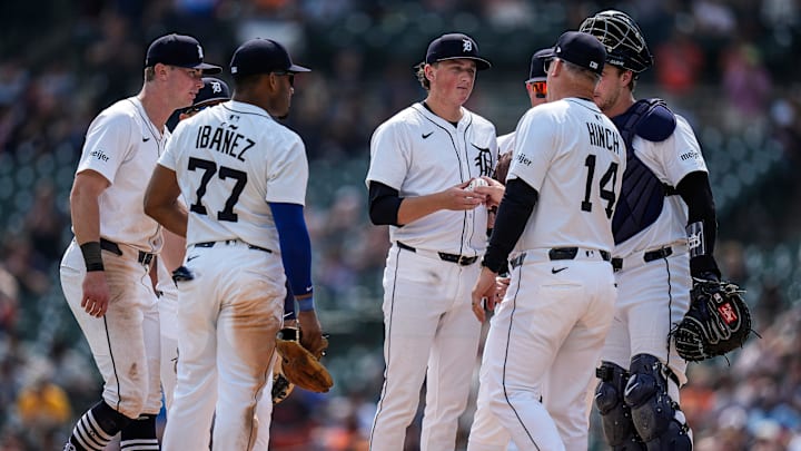 Detroit Tigers pitcher Reese Olson (45) hands the ball to manager A.J. Hinch (14) for pitching change against San Diego Padres during the eighth inning at Comerica Park in Detroit on Wednesday, April 23, 2025