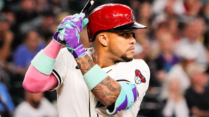 Sep 1, 2025; Phoenix, Arizona, USA;  Arizona Diamondbacks second base Ketel Marte (4) at bat in the first inning during the game between the Texas Rangers and Arizona Diamondbacks at Chase Field. Mandatory Credit: Arianna Grainey-Imagn Images