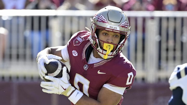 Nov 23, 2024; Tallahassee, Florida, USA; Florida State Seminoles wide receiver Ja'Khi Douglas (0) runs the ball during the first half against the Charleston Southern Buccaneers at Doak S. Campbell Stadium. Mandatory Credit: Melina Myers-Imagn Images Nov 23, 2024; Tallahassee, Florida, USA; Florida State Seminoles wide receiver Ja'Khi Douglas (0) runs the ball during the first half against the Charleston Southern Buccaneers at Doak S. Campbell Stadium. Mandatory Credit: Melina Myers-Imagn Images