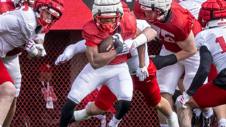 Running back Jamal Rule tries to escape a defender's grasp during Nebraska's 2026 Red-White Spring Game. Running back Jamal Rule tries to escape a defender's grasp during Nebraska's 2026 Red-White Spring Game.