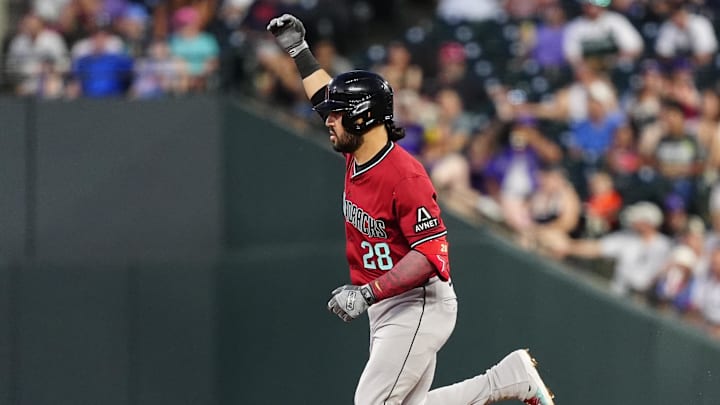 Jun 20, 2025; Denver, Colorado, USA; Arizona Diamondbacks third baseman Eugenio Suarez (28) celebrates his two run home run in the sixth inning against the Colorado Rockies at Coors Field. 