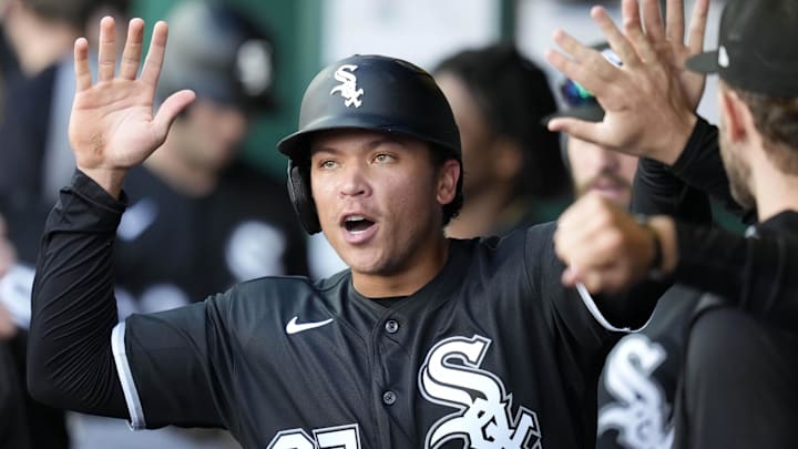 Apr 12, 2026; Kansas City, Missouri, USA; Chicago White Sox left fielder Dustin Harris (37) is congratulated by teammates after scoring a run during the seventh inning against the Kansas City Royals at Kauffman Stadium. Mandatory Credit: Jay Biggerstaff-Imagn Images