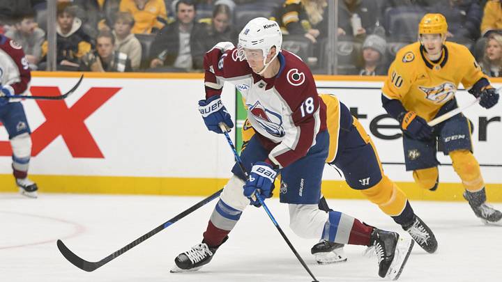 Dec 9, 2025; Nashville, Tennessee, USA;  Colorado Avalanche center Jack Drury (18) takes a shot on goal against the Nashville Predators during the third period at Bridgestone Arena. Mandatory Credit: Steve Roberts-Imagn Images