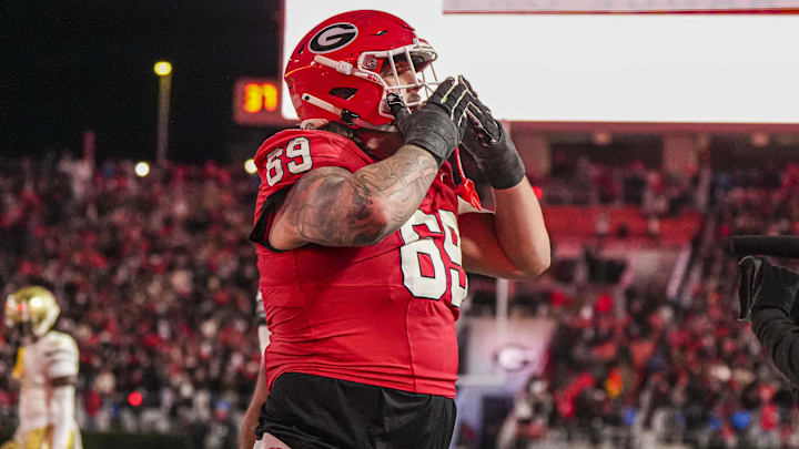 Georgia Bulldogs offensive lineman Tate Ratledge (69) reacts after a touchdown against the Georgia Tech Yellow Jackets 