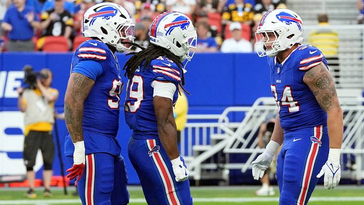 Buffalo Bills DT T.J. Sanders, LB Keonta Jenkins, and DE Landon Jackson celebrate after a sack against the Steelers. Buffalo Bills DT T.J. Sanders, LB Keonta Jenkins, and DE Landon Jackson celebrate after a sack against the Steelers.