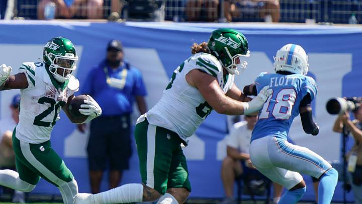 New York Jets running back Breece Hall (20) scrambles upfield during the third quarter against the Tennessee Titans at Nissan Stadium in Nashville, Tenn., Sunday, Sept. 13, 2026.