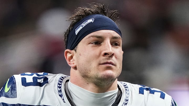 Ty Okada of the Seattle Seahawks runs onto the field