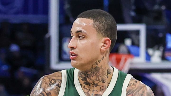 Orlando Magic guard Jalen Suggs defends Milwaukee Bucks forward Kyle Kuzma.