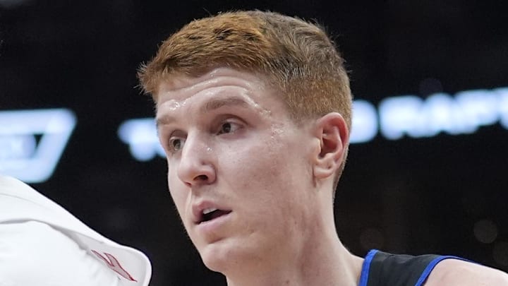 Toronto Raptors guard Ja'Kobe Walter (14) controls the ball against Detroit Pistons guard Kevin Huerter (27) during the second half at Scotiabank Arena on Feb 11, 2026.