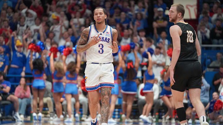 Kansas Jayhawks guard Tre White (3) reacts after sinking a three during the second half of the exhibition game against Fort Hays State Tigers inside Allen Fieldhouse on Tuesday, October, 28, 2025.