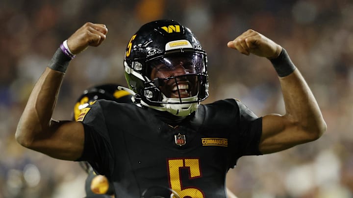 Washington Commanders quarterback Jayden Daniels (5) reacts after a play against the Chicago Bears during the second half at Northwest Stadium. Mandatory Credit: Geoff Burke-Imagn Images Washington Commanders quarterback Jayden Daniels (5) reacts after a play against the Chicago Bears during the second half at Northwest Stadium. Mandatory Credit: Geoff Burke-Imagn Images