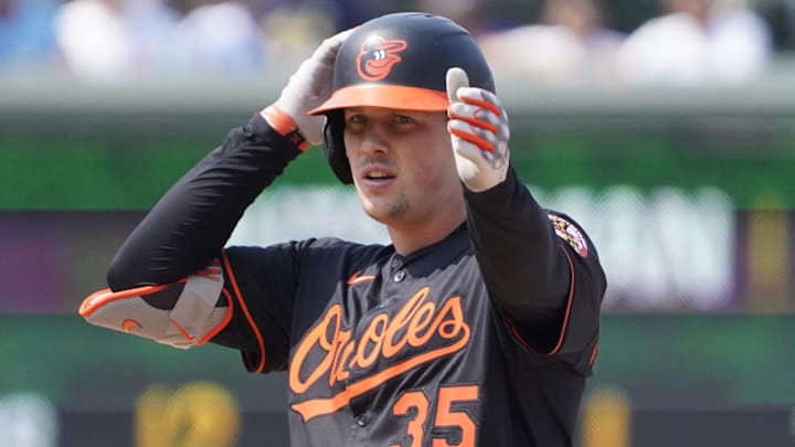 Aug 1, 2025; Chicago, Illinois, USA; Baltimore Orioles catcher Adley Rutschman (35) gestures after hitting a double against the Chicago Cubs during the ninth inning at Wrigley Field. Mandatory Credit: David Banks-Imagn Images