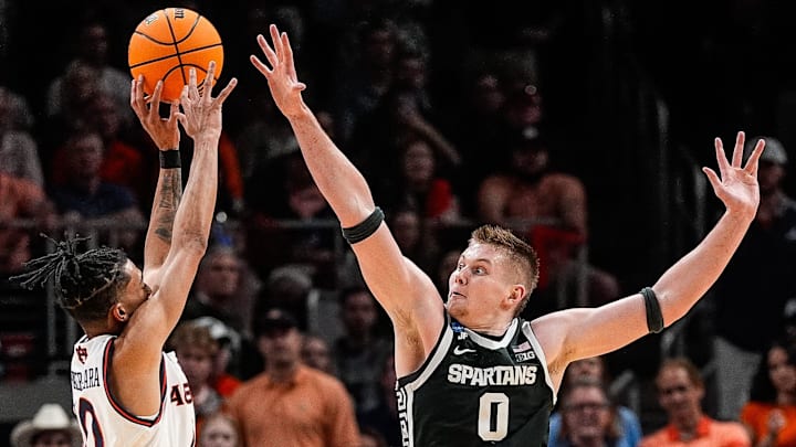Auburn guard Chad Baker-Mazara (10) shoots a 3-pointer against Michigan State forward Jaxon Kohler (0) during the second half of the Elite Eight round of NCAA tournament at State Farm Arena in Atlanta, Ga. on Sunday, March 30, 2025. Auburn guard Chad Baker-Mazara (10) shoots a 3-pointer against Michigan State forward Jaxon Kohler (0) during the second half of the Elite Eight round of NCAA tournament at State Farm Arena in Atlanta, Ga. on Sunday, March 30, 2025.