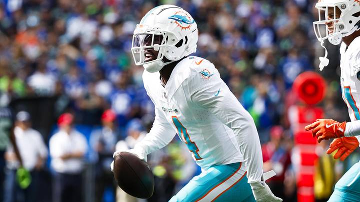 Sep 22, 2024; Seattle, Washington, USA; Miami Dolphins cornerback Kader Kohou (4) celebrates following an interception against the Seattle Seahawks during the first quarter at Lumen Field. Mandatory Credit: Joe Nicholson-Imagn Images Sep 22, 2024; Seattle, Washington, USA; Miami Dolphins cornerback Kader Kohou (4) celebrates following an interception against the Seattle Seahawks during the first quarter at Lumen Field. Mandatory Credit: Joe Nicholson-Imagn Images