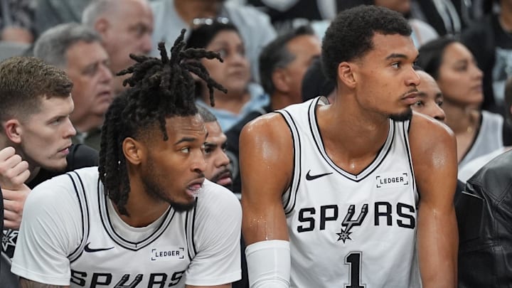 Oct 26, 2025; San Antonio, Texas, USA; San Antonio Spurs guard Stephon Castle (5) and San Antonio Spurs forward Victor Wembanyama (1) look on in the first half against the Brooklyn Nets at Frost Bank Center. Mandatory Credit: Daniel Dunn-Imagn Images