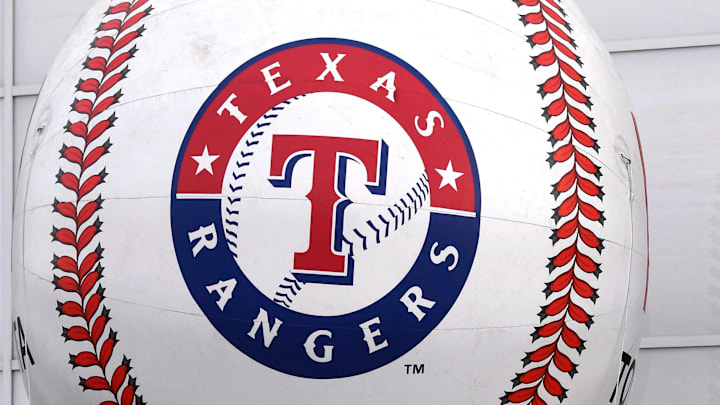 The Texas Rangers logo on a baseball. 