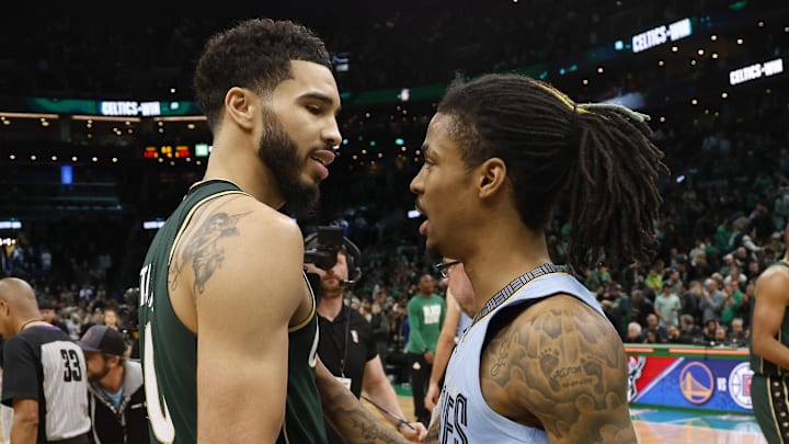 Feb 12, 2023; Boston, Massachusetts, USA; Boston Celtics forward Jayson Tatum (0) and Memphis Grizzlies guard Ja Morant (12) talks after the Celtics win at TD Garden. Mandatory Credit: Winslow Townson-Imagn Images