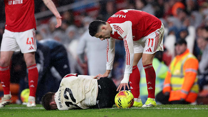 Gabriel Martinelli (right) was not impressed with Conor Bradley’s injury.