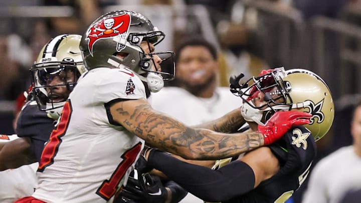 Sep 18, 2022; New Orleans, Louisiana, USA;  New Orleans Saints cornerback Marshon Lattimore (23) and safety Marcus Maye (6) get into a penalty with Tampa Bay Buccaneers wide receiver Mike Evans (13) and they are ejected after the play during the second half at Caesars Superdome. Mandatory Credit: Stephen Lew-Imagn Images