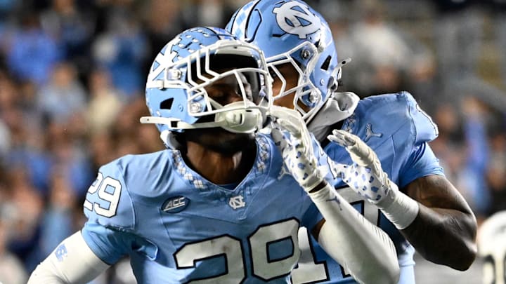 Nov 16, 2024; Chapel Hill, North Carolina, USA; North Carolina Tar Heels defensive back Marcus Allen (29) celebrates after making an interception in the third quarter at Kenan Memorial Stadium. Mandatory Credit: Bob Donnan-Imagn Images