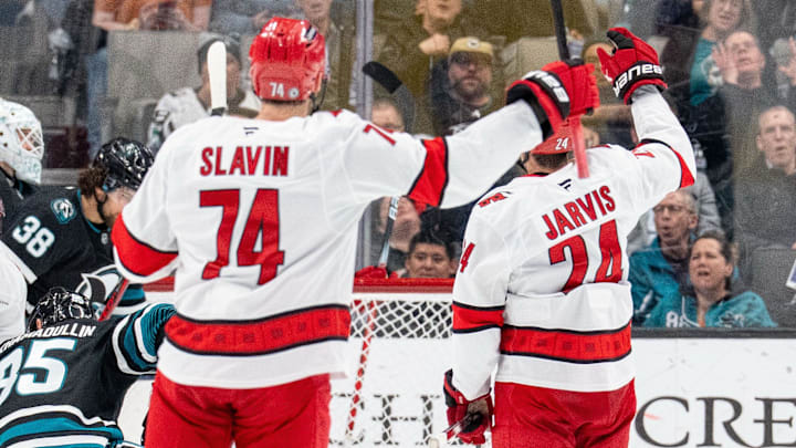 Mar 20, 2025; San Jose, California, USA; Carolina Hurricanes center Seth Jarvis (24) and Carolina Hurricanes defenseman Jaccob Slavin (74) and teammates celebrate after the goal against the San Jose Sharks during the second period at SAP Center at San Jose. Mandatory Credit: Neville E. Guard-Imagn Images Mar 20, 2025; San Jose, California, USA; Carolina Hurricanes center Seth Jarvis (24) and Carolina Hurricanes defenseman Jaccob Slavin (74) and teammates celebrate after the goal against the San Jose Sharks during the second period at SAP Center at San Jose. Mandatory Credit: Neville E. Guard-Imagn Images