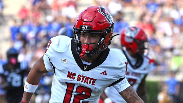 Sep 20, 2025; Durham, North Carolina, USA;  North Carolina State Wolfpack wide receiver Teddy Hoffmann (12) goes for the ball against the Duke Blue Devils during the first quarter at Wallace Wade Stadium. Mandatory Credit: Zachary Taft-Imagn Images
