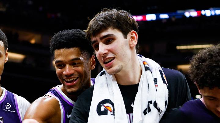 Dec 21, 2025; Sacramento, California, USA; Sacramento Kings forward Keegan Murray (13) and center Dylan Cardwell (32) and center Maxime Raynaud (42) and guard Nique Clifford (5) prepare to light the beam in celebration of their win against the Houston Rockets at Golden 1 Center. Mandatory Credit: Sergio Estrada-Imagn Images